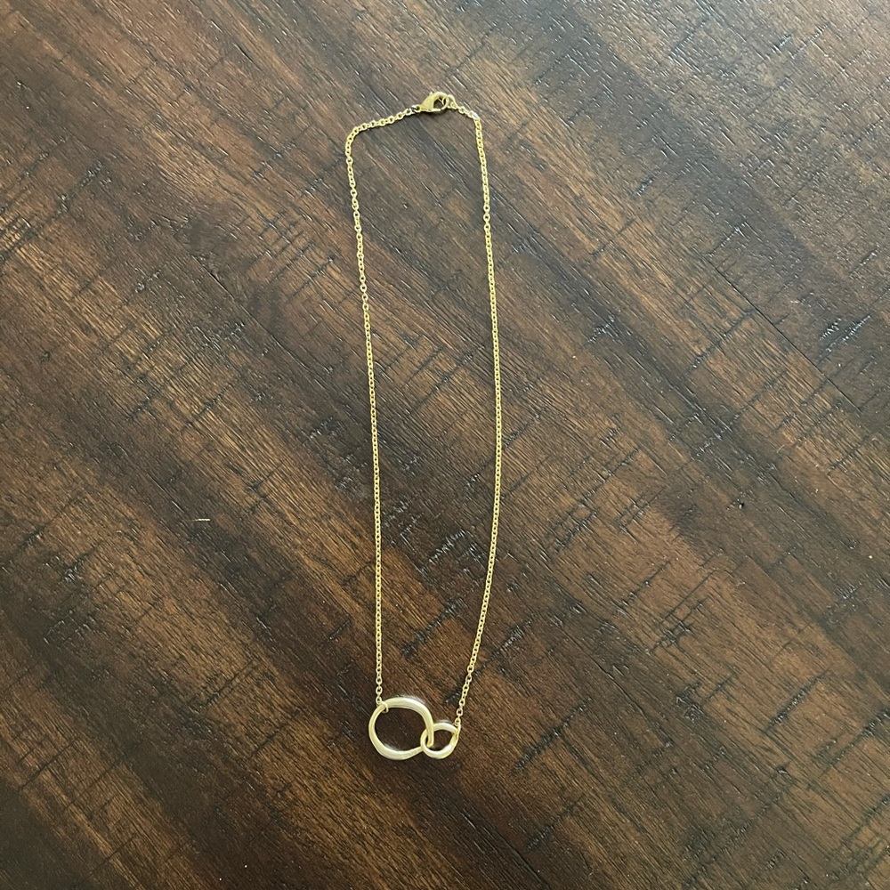 Gold finish choker hangs about 9”